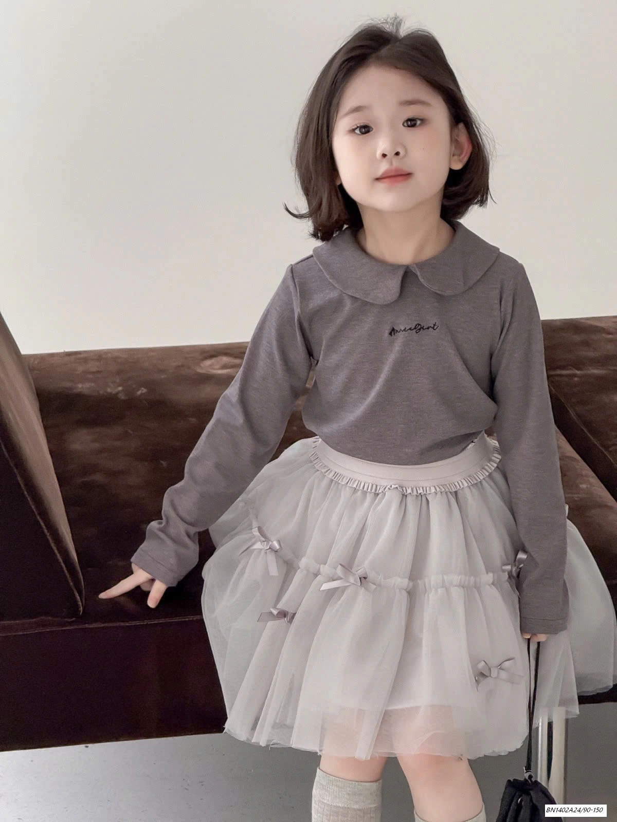 CHÂN VÁY VOAN BỒNG GẮN NƠ